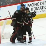 Arizona Coyotes goaltender Adin Hill (31) celebrates a win against the St. Louis Blues with Coyotes defenseman Alex Goligoski (33) as time expires in the third period of an NHL hockey game, Saturday, Dec. 1, 2018, in Glendale, Ariz. The Coyotes defeated the Blues 6-1. (AP Photo/Ross D. Franklin)