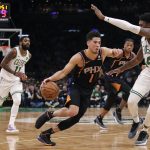 Phoenix Suns guard Devin Booker (1) drives to the basket against the Boston Celtics during the second half of a basketball game in Boston, Wednesday, Dec. 19, 2018. The Suns defeated the Celtics 111-103. (AP Photo/Charles Krupa)