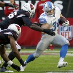 Detroit Lions running back Zach Zenner (34) tries to elude Arizona Cardinals defensive end Zach Moore (56) during the first half of NFL football game, Sunday, Dec. 9, 2018, in Glendale, Ariz. (AP Photo/Rick Scuteri)