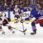 New York Rangers defenseman Brady Skjei (76) passes the puck around Arizona Coyotes center Brad Richardson (15) during the first period of an NHL hockey game, Friday, Dec. 14, 2018, at Madison Square Garden in New York. (AP Photo/Mary Altaffer)