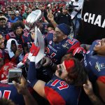 Fresno State players celebrate with the trophy after defeating Arizona State in the Las Vegas Bowl NCAA college football game, Saturday, Dec. 15, 2018, in Las Vegas. Fresno State won 31-20. (AP Photo/John Locher)