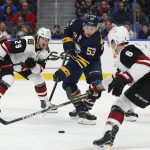 Buffalo Sabres forward Jeff Skinner (53) carries the puck past Arizona Coyotes forward Mario Kempe (29) during the first period of an NHL hockey game, Thursday, Dec. 13, 2018, in Buffalo N.Y. (AP Photo/Jeffrey T. Barnes)