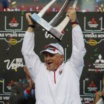 Fresno State head coach Jeff Tedford holds up the trophy after his team defeated Arizona State in the Las Vegas Bowl NCAA college football game, Saturday, Dec. 15, 2018, in Las Vegas. (AP Photo/John Locher)