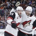 Arizona Coyotes defenseman Oliver Ekman-Larsson, left, celebrates after scoring after with center Alex Galchenyuk during the first period of an NHL hockey game against the Anaheim Ducks in Anaheim, Calif., Saturday, Dec. 29, 2018. (AP Photo/Chris Carlson)
