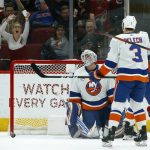 New York Islanders goaltender Robin Lehner, left, gives up a goal to Arizona Coyotes' Mario Kempe as Islanders defenseman Adam Pelech (3) looks on during the first period of an NHL hockey game Tuesday, Dec. 18, 2018, in Glendale, Ariz. (AP Photo/Ross D. Franklin)
