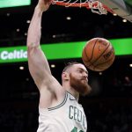 Boston Celtics center Aron Baynes (46) slams a dunk during the first quarter of a basketball game against the Phoenix Suns in Boston, Wednesday, Dec. 19, 2018. (AP Photo/Charles Krupa)