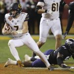 California quarterback Chase Garbers (7) slips past TCU defensive end L.J. Collier (91) during the first half of the Cheez-It Bowl NCAA college football game Wednesday, Dec. 26, 2018, in Phoenix. (AP Photo/Ross D. Franklin)