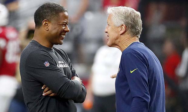 Seattle Seahawks head coach Pete Carroll, right, greets Arizona Cardinals head coach Steve Wilks pr...