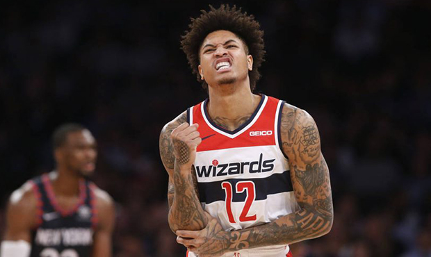 Washington Wizards' Kelly Oubre Jr. reacts after getting fouled by New York Knicks' Noah Vonleh dur...