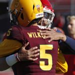 Fresno State quarterback Marcus McMaryion, right, embraces Arizona State quarterback Manny Wilkins (5) before the Las Vegas Bowl NCAA college football game, Saturday, Dec. 15, 2018, in Las Vegas. (AP Photo/John Locher)