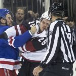 New York Rangers defenseman Brendan Smith (42) fights Arizona Coyotes center Nick Cousins (25) during the first period of an NHL hockey game, Friday, Dec. 14, 2018, at Madison Square Garden in New York. (AP Photo/Mary Altaffer)