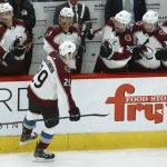 Colorado Avalanche center Nathan MacKinnon (29) celebrates his goal against the Arizona Coyotes with teammates on the bench during the third period of an NHL hockey game Saturday, Dec. 22, 2018, in Glendale, Ariz. The Coyotes defeated the Avalanche 6-4. (AP Photo/Ross D. Franklin)