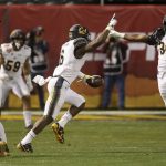 California safety Jaylinn Hawkins (6) celebrates his interception against TCU with linebacker Alex Funches (36) and cornerback Camryn Bynum (24) as linebacker Jordan Kunaszyk (59) watches during the first half of the Cheez-It Bowl NCAA college football game Wednesday, Dec. 26, 2018, in Phoenix. (AP Photo/Ross D. Franklin)