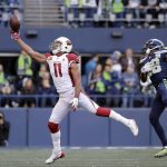 Arizona Cardinals' Larry Fitzgerald (11) just misses a catch in front of Seattle Seahawks' Justin Coleman during the first half of an NFL football game, Sunday, Dec. 30, 2018, in Seattle. (AP Photo/Ted S. Warren)