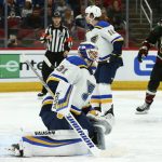 St. Louis Blues goaltender Chad Johnson (31) gives up a goal to Arizona Coyotes' Clayton Keller as Blues center Robert Thomas (18) looks away and Coyotes center Alex Galchenyuk, right, celebrates during the second period of an NHL hockey game, Saturday, Dec. 1, 2018, in Glendale, Ariz. (AP Photo/Ross D. Franklin)