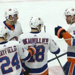 New York Islanders left wing Anthony Beauvillier (18) celebrates his goal against the Arizona Coyotes with Islanders center Mathew Barzal (13), defenseman Scott Mayfield (24) and right wing Josh Bailey (12) during the second period of an NHL hockey game Tuesday, Dec. 18, 2018, in Glendale, Ariz. (AP Photo/Ross D. Franklin)