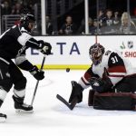 Arizona Coyotes goaltender Adin Hill (31) stops a shot from Nate Thompson, left, during the second period of an NHL hockey game Tuesday, Dec. 4, 2018, in Los Angeles. (AP Photo/Marcio Jose Sanchez)