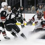 Arizona Coyotes goaltender Adin Hill, right, stops a shot from Los Angeles Kings' Brendan Leipsic, center, during the second period of an NHL hockey game Tuesday, Dec. 4, 2018, in Los Angeles. (AP Photo/Marcio Jose Sanchez)