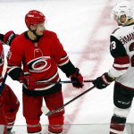 Carolina Hurricanes' Sebastian Aho (20) exchanges words with Arizona Coyotes' Oliver Ekman-Larsson (23) as Hurricanes' Dougie Hamilton (19) joins the conversation during the third period of an NHL hockey game, Sunday, Dec. 16, 2018, in Raleigh, N.C. (AP Photo/Karl B DeBlaker)