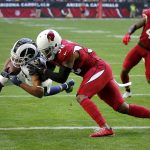 Los Angeles Rams wide receiver Robert Woods (17) dives in for a touchdown as Arizona Cardinals defensive back David Amerson (38) defends during the first half of an NFL football game, Sunday, Dec. 23, 2018, in Glendale, Ariz. (AP Photo/Rick Scuteri)