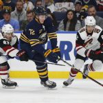 Buffalo Sabres forward Tage Thompson (72) carries the puck between Arizona Coyotes Conor Garland (83) and Jordan Oesterle (82) during the first period of an NHL hockey game, Thursday, Dec. 13, 2018, in Buffalo N.Y. (AP Photo/Jeffrey T. Barnes)