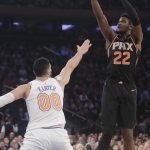 Phoenix Suns' Deandre Ayton (22) shoots over New York Knicks' Enes Kanter (00) during the first half of an NBA basketball game Monday, Dec. 17, 2018, in New York. (AP Photo/Frank Franklin II)