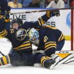 Buffalo Sabres defenseman Rasmus Dahlin (26) collides with goalie Carter Hutton (40) during the second period of an NHL hockey game against the Arizona Coyotes, Thursday, Dec. 13, 2018, in Buffalo N.Y. (AP Photo/Jeffrey T. Barnes)