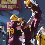 Arizona State running back Eno Benjamin (3) celebrates with teammates after scoring a touchdown against Fresno State during the first half of the Las Vegas Bowl NCAA college football game, Saturday, Dec. 15, 2018, in Las Vegas. (AP Photo/John Locher)