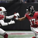 Atlanta Falcons wide receiver Marvin Hall (17) fends off Arizona Cardinals strong safety Budda Baker (36) after a catch during the first half of an NFL football game, Sunday, Dec. 16, 2018, in Atlanta. (AP Photo/Danny Karnik)