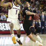 Princeton guard Jose Morales (2) drives to the basket as Arizona State's Remy Martin defends during the first half of an NCAA college basketball game Saturday, Dec. 29, 2018, in Tempe, Ariz. (AP Photo/Ralph Freso)