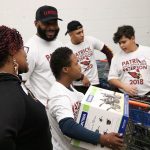 Arizona Cardinals’ Antoine Bethea and his group wait to check out during Patrick Peterson’s “Shop with a Jock” event on December 17, 2018, in Tempe, Ariz. (Tyler Drake/Arizona Sports)
