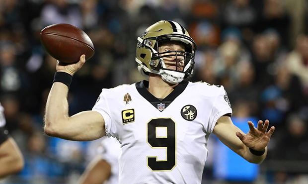In this Dec. 17, 2018 file photo New Orleans Saints' Drew Brees (9) looks to pass against the Carol...