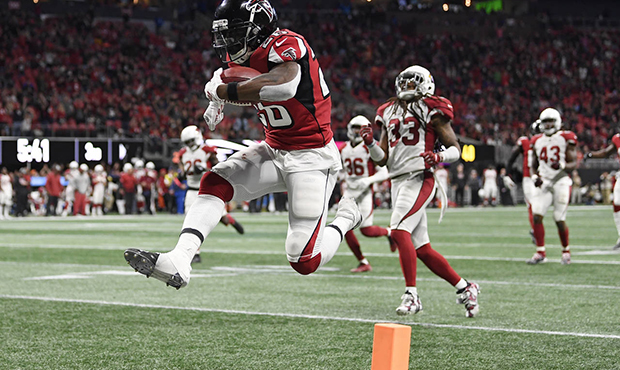 Atlanta Falcons running back Tevin Coleman (26) leaps into the end zone as he scores on a pass from...