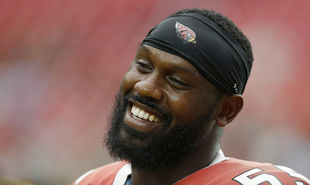 Arizona Cardinals defensive end Chandler Jones smiles as he walks onto the field prior to an NFL fo...