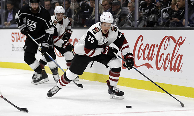 Arizona Coyotes' Nick Cousins (25) controls the puck against the Los Angeles Kings during the first...
