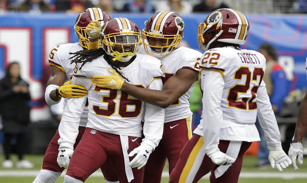Washington Redskins free safety D.J. Swearinger (36) is congratulated by teammates after intercepti...