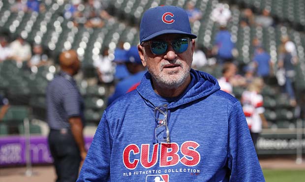 Chicago Cubs manager Joe Maddon walks on the field before a baseball game against the Chicago White...