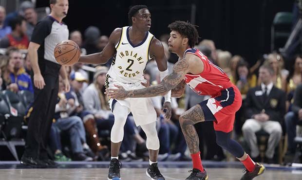 Indiana Pacers guard Darren Collison (2) is guarded by Washington Wizards forward Kelly Oubre Jr. (...