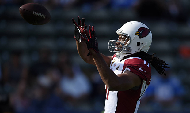 Arizona Cardinals wide receiver Larry Fitzgerald warms up before an NFL football game against the L...