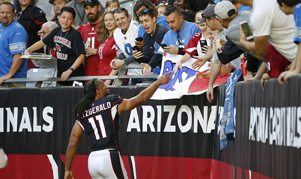 Arizona Cardinals wide receiver Larry Fitzgerald (11) greets fans prior to an NFL football game aga...