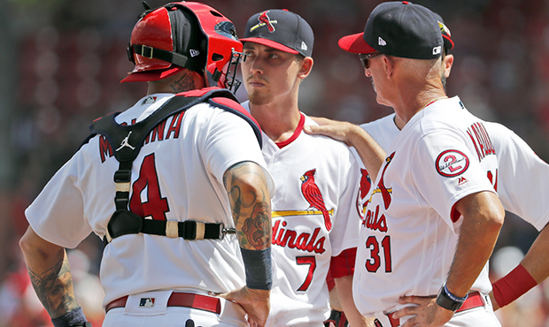 St. Louis Cardinals pitching coach Mike Maddux (31) talks with starting pitcher Luke Weaver (7) as ...
