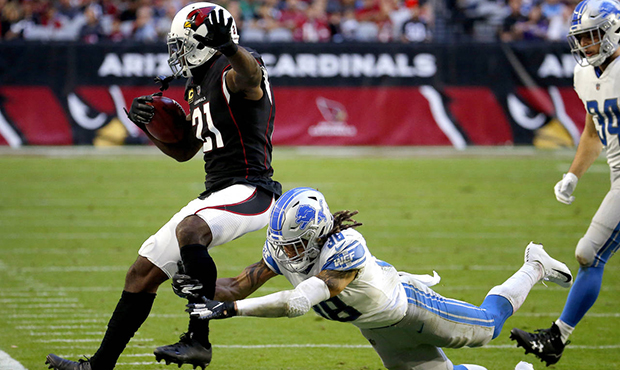 Arizona Cardinals cornerback Patrick Peterson (21) is knocked out of bounds by Detroit Lions defens...