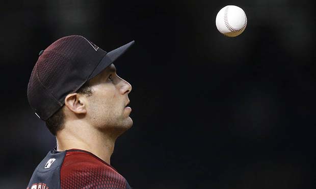 Arizona Diamondbacks first baseman Paul Goldschmidt tosses the baseball in the air during the ninth...