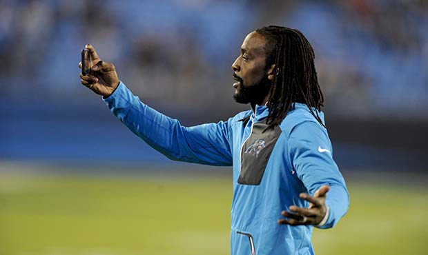 Retired Carolina Panthers cornerback Charles Tillman take a photo before an NFL game between the Ca...