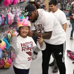 Arizona Cardinals’ Haason Reddick makes sure the new bike helmet fits just right during Patrick Peterson’s “Shop with a Jock” event on December 17, 2018, in Tempe, Ariz. (Tyler Drake/Arizona Sports)