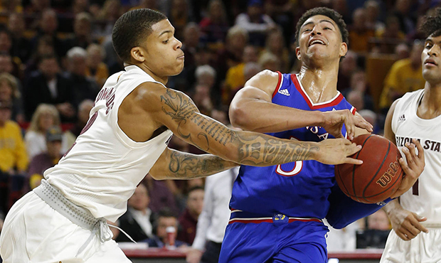 Arizona State guard Rob Edwards, left, knocks the ball away from Kansas guard Quentin Grimes during...