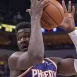 Phoenix Suns center Deandre Ayton (22) regains control of the ball during the first half of an NBA basketball game against the Indiana Pacers Tuesday, Jan. 15, 2019, in Indianapolis. (AP Photo/Doug McSchooler)