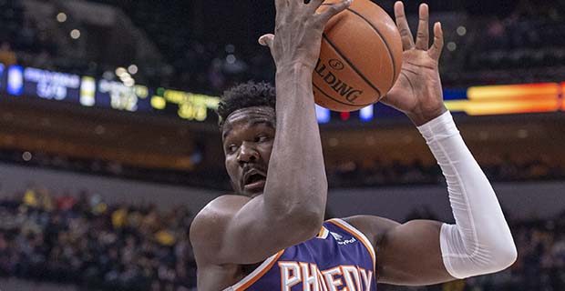 Phoenix Suns center Deandre Ayton (22) regains control of the ball during the first half of an NBA ...