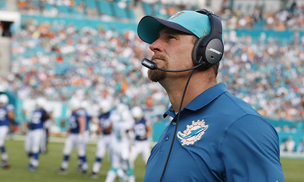Miami Dolphins interim head coach Dan Campbell looks up during the second half of an NFL football g...