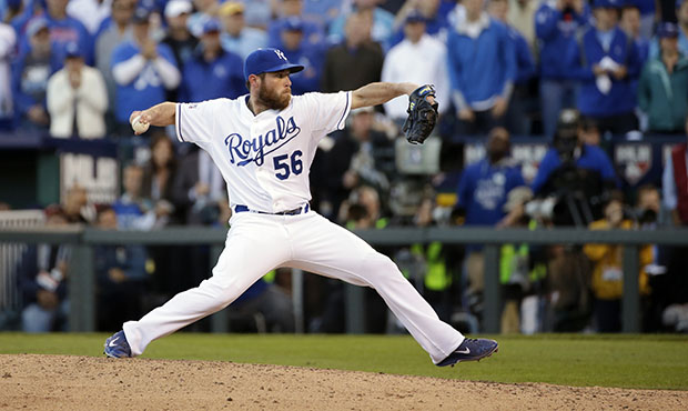Kansas City Royals relief pitcher Greg Holland throws during the ninth inning of Game 4 of the Amer...